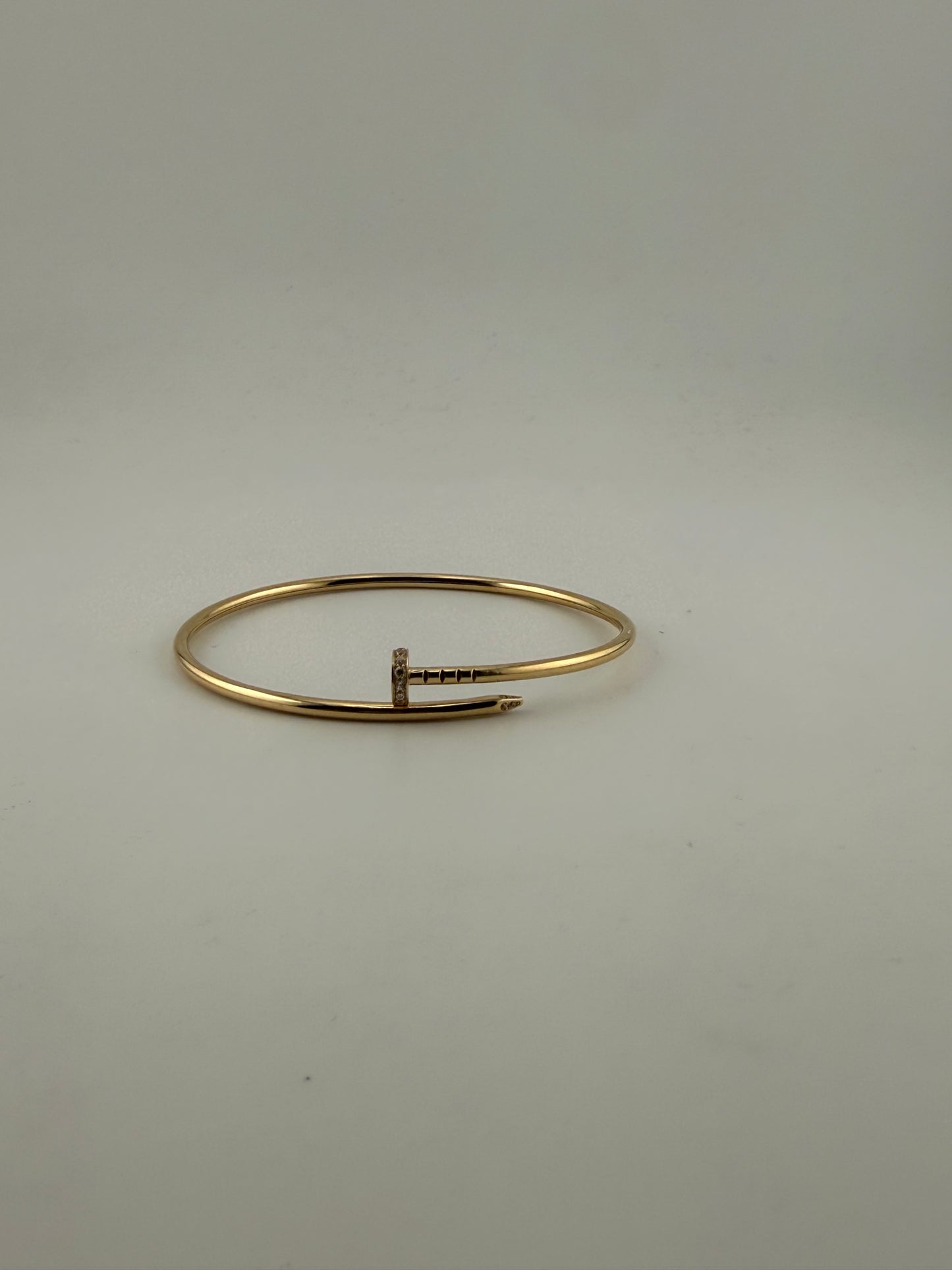 Thin twist nail bracelet, with premium cz stones, 18k gold
