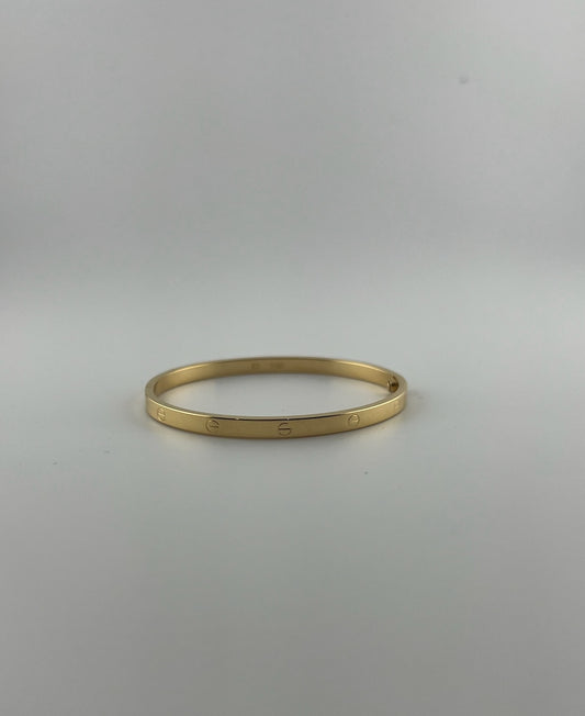 Thin hollow bangle, 18k gold, opens with a screw