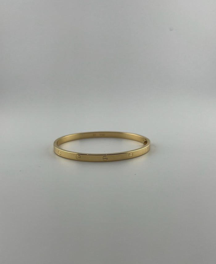 Thin hollow bangle, 18k gold, opens with a screw