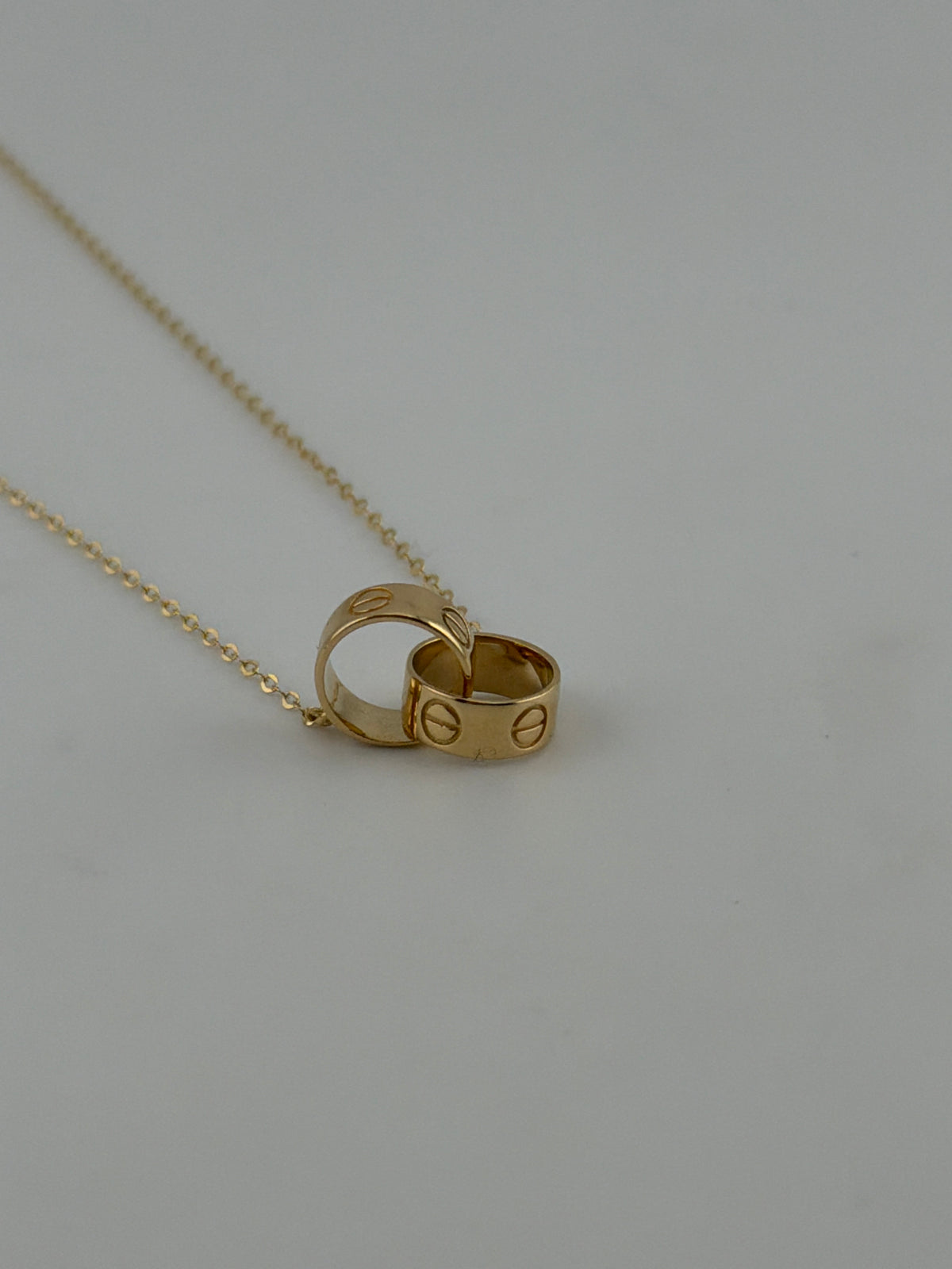 Solid 18k gold interlocking rings necklace - Image 1