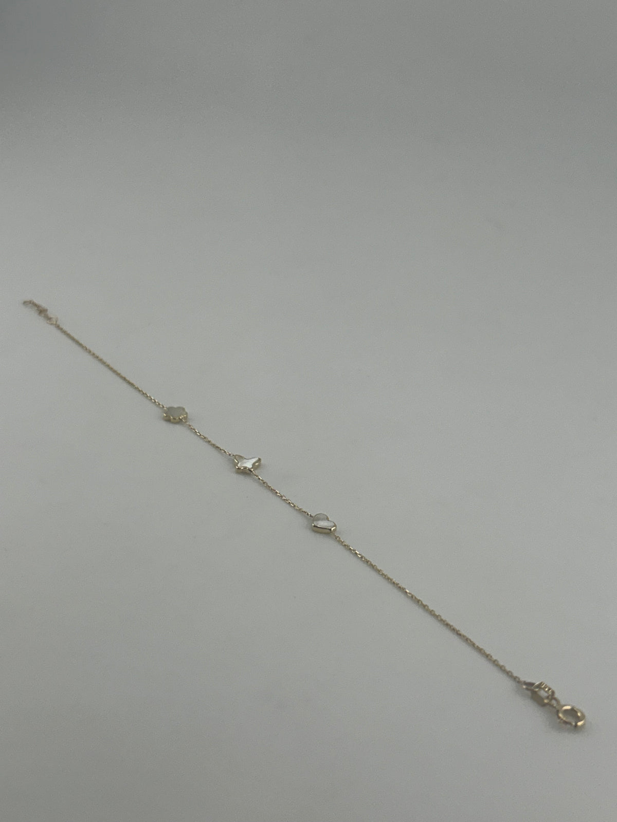 18K Yellow Gold White Stone Star, Butterfly & Heart Bracelet - Image 2