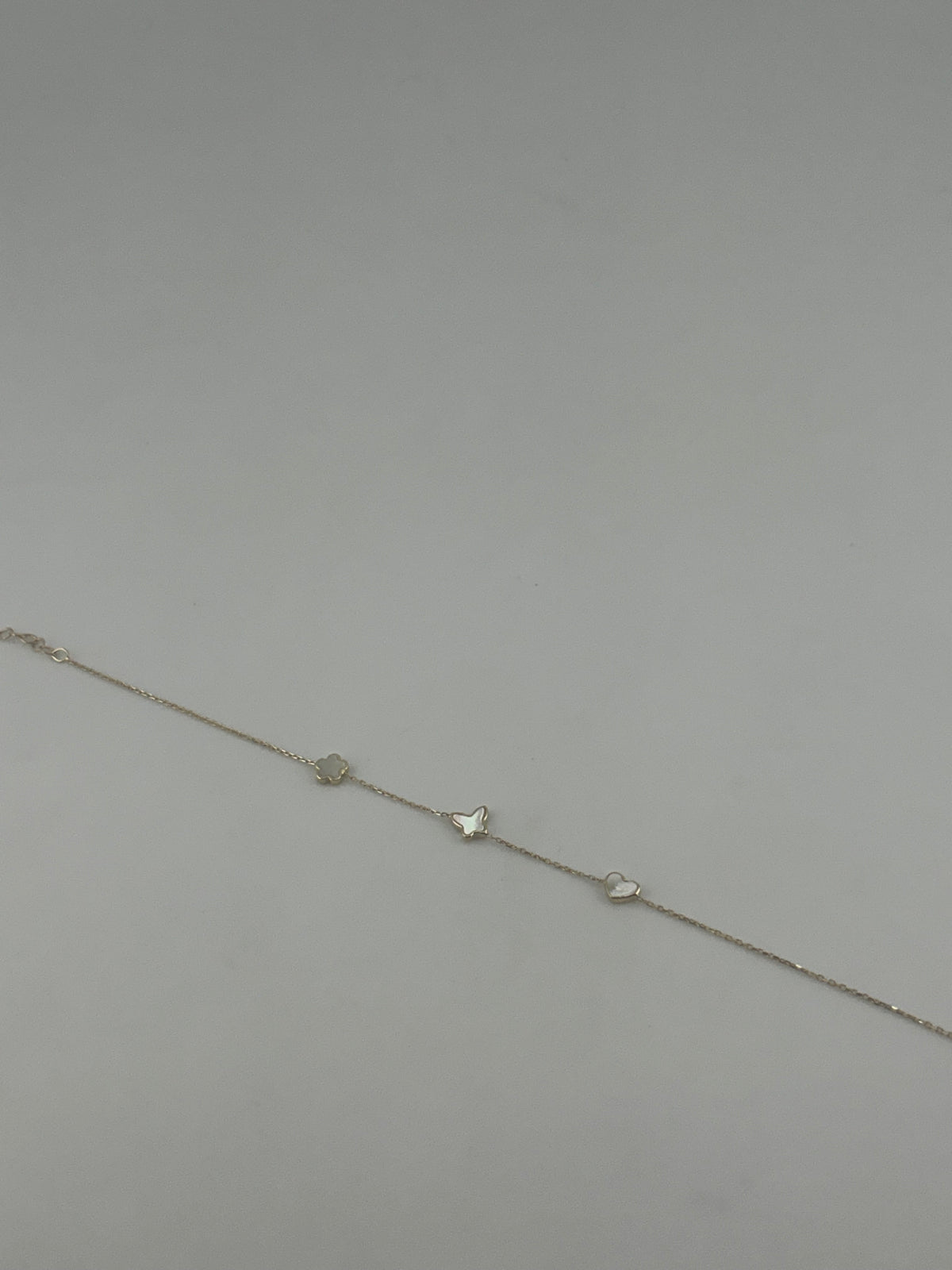 18K Yellow Gold White Stone Star, Butterfly & Heart Bracelet - Image 3