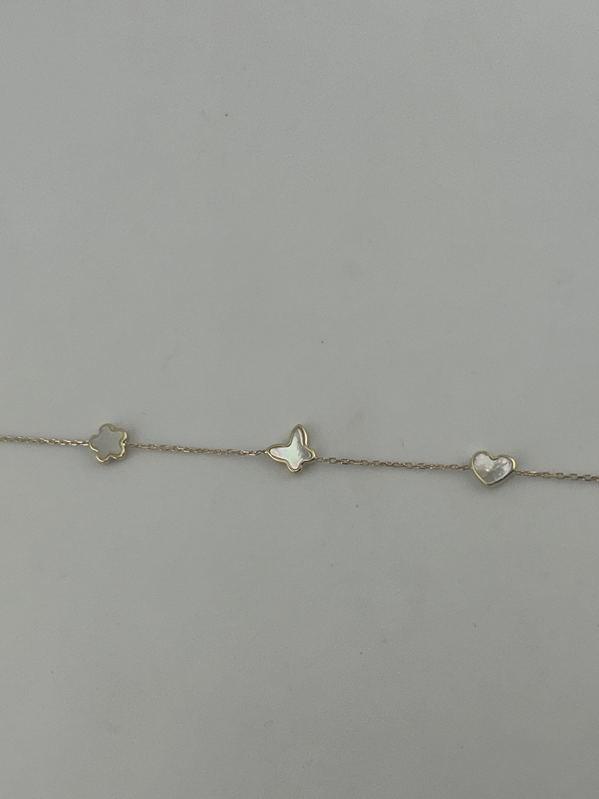 18K Yellow Gold White Stone Star, Butterfly & Heart Bracelet - Image 1