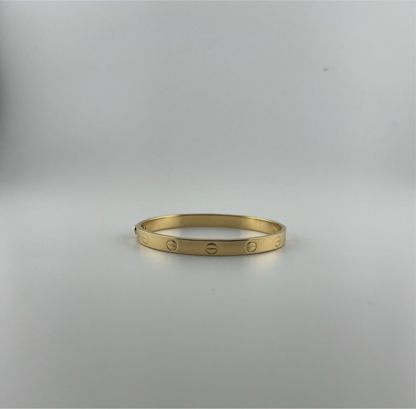 Bangle that opens with a screw, 18k gold, semisolid, regular width