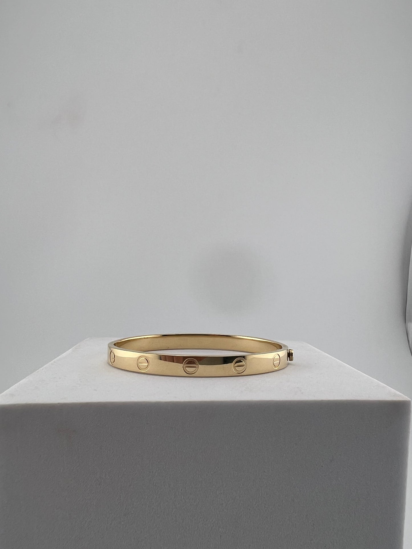 Bangle that opens with a screw, 18k gold, semisolid, regular width