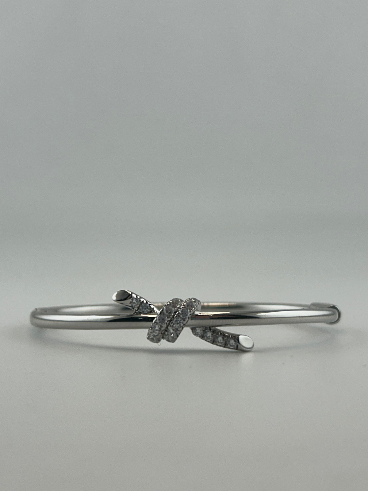 Silver Knot Bangle with CZ Stones - Image 1