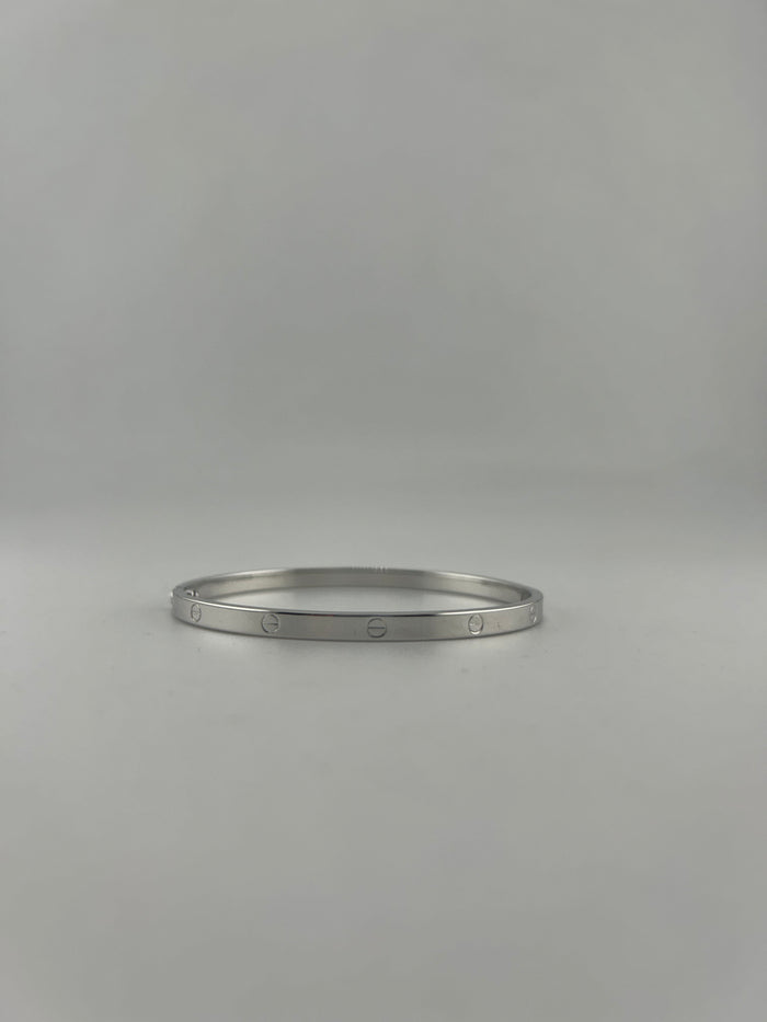 Thin hollow bangle, 18k white gold, opens with screw