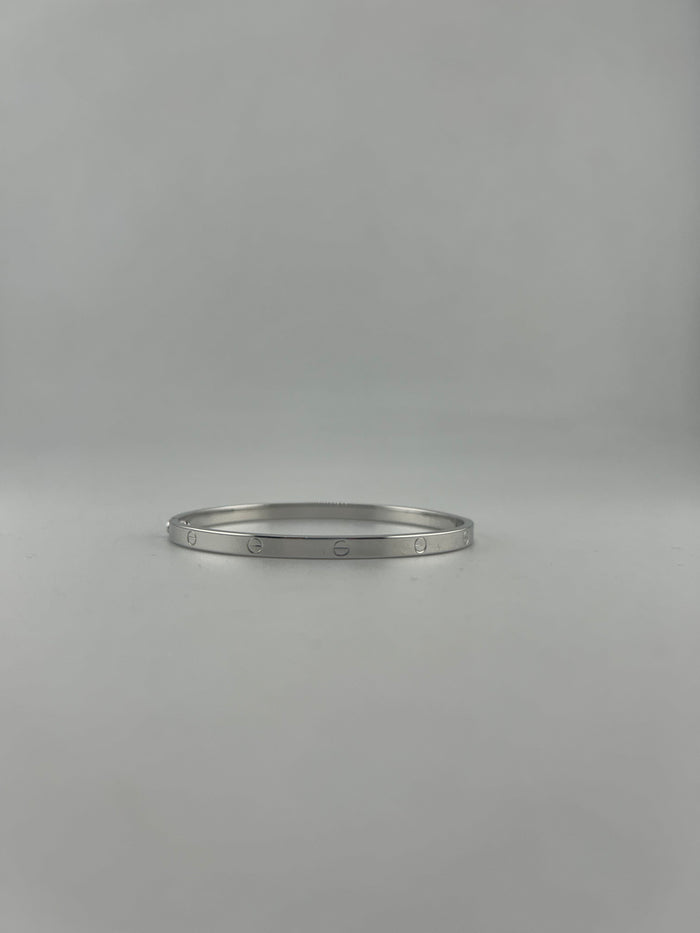 Thin hollow bangle, 18k white gold, opens with screw