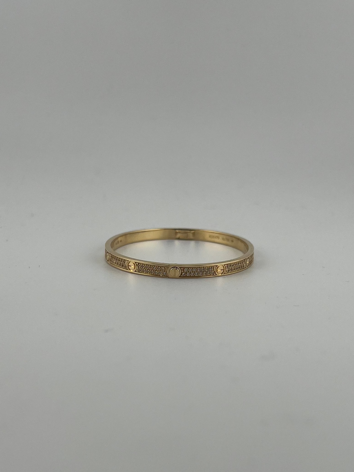 Yellow gold Full-Pave bangle with screws markings - Image 1