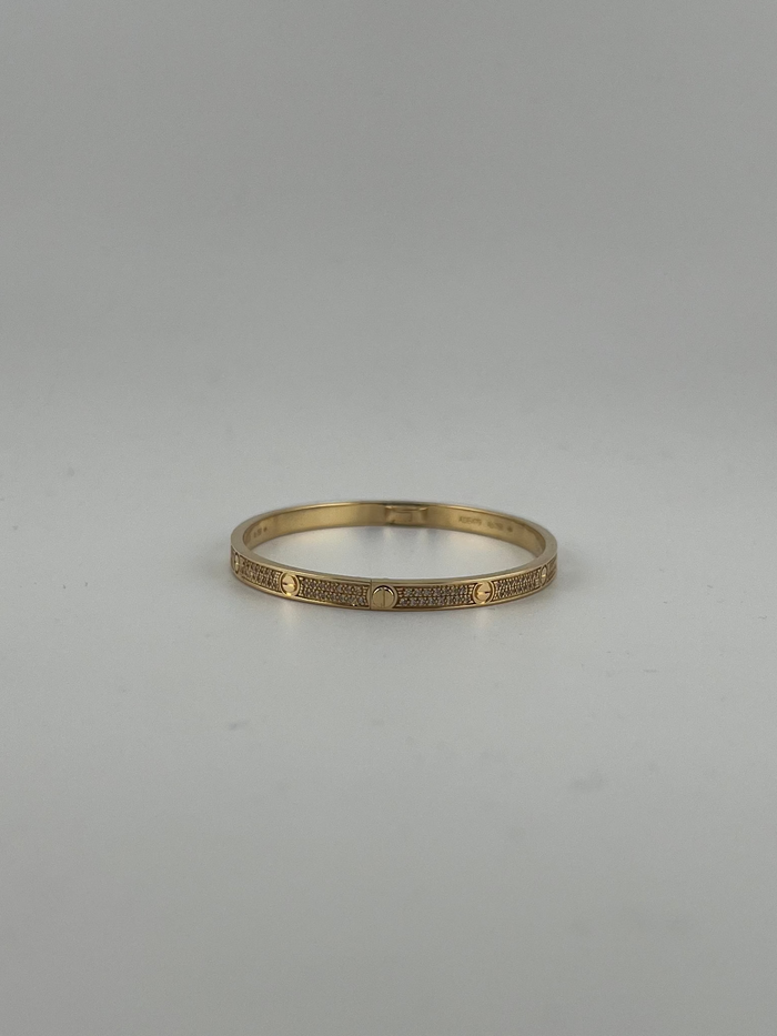 Yellow gold Full-Pave bangle with screws markings