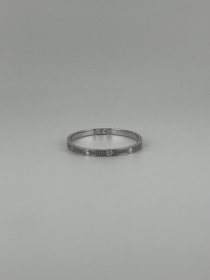 White gold 18K Full-pave bangle with screw markings